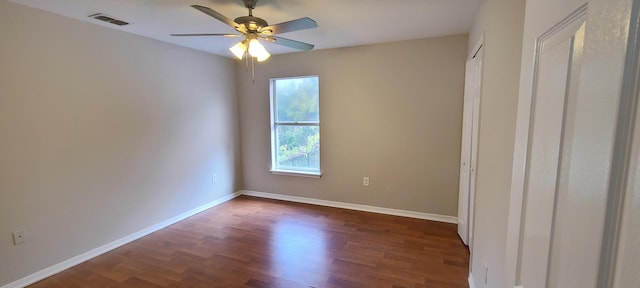 unfurnished bedroom with dark hardwood / wood-style flooring and ceiling fan