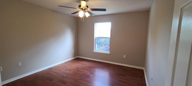 spare room with ceiling fan and dark hardwood / wood-style floors