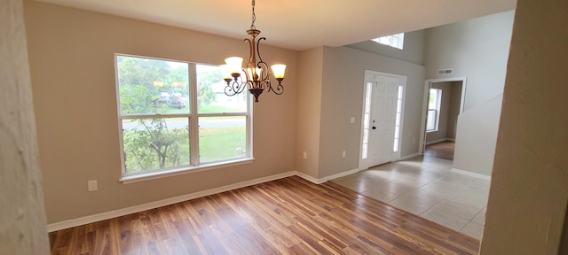 interior space featuring plenty of natural light and a chandelier