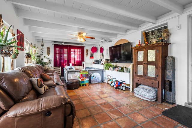 tiled living room featuring beam ceiling and ceiling fan