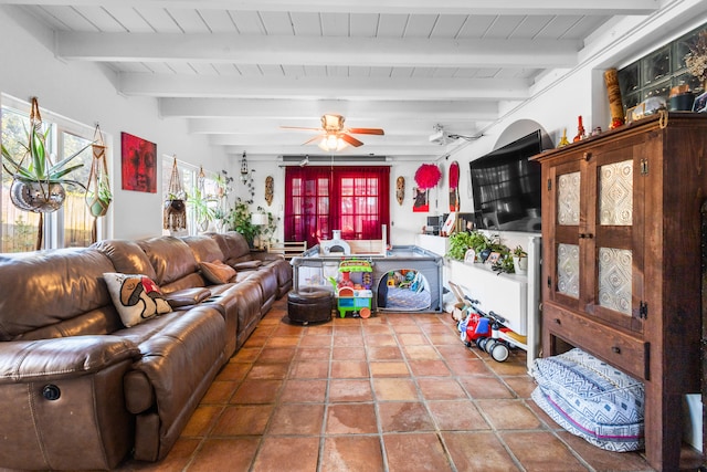 tiled living room featuring ceiling fan, wood ceiling, and beamed ceiling