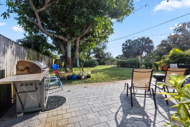 view of side of home with a patio