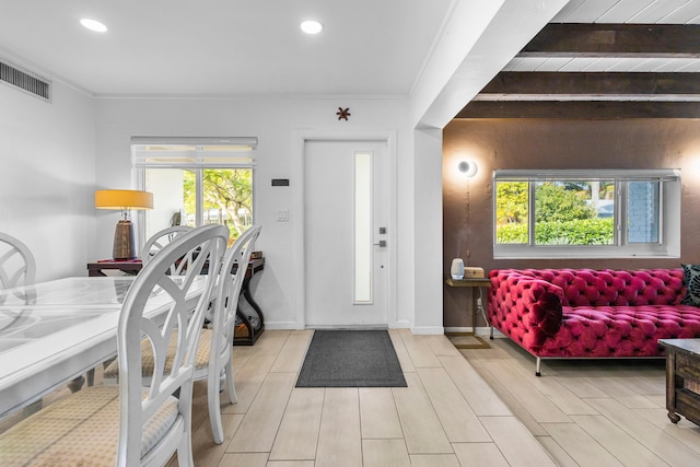 entrance foyer featuring crown molding