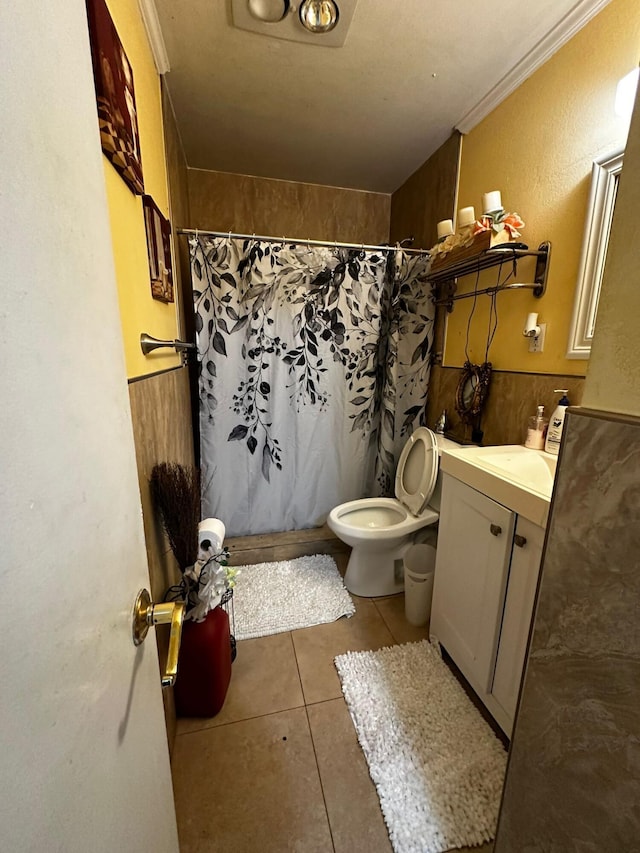 bathroom with walk in shower, vanity, and ornamental molding