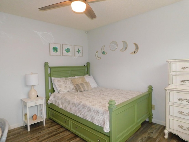 bedroom featuring dark wood-type flooring and ceiling fan