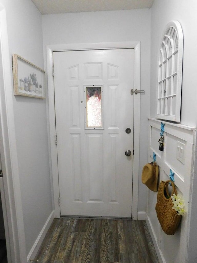 doorway featuring dark hardwood / wood-style floors