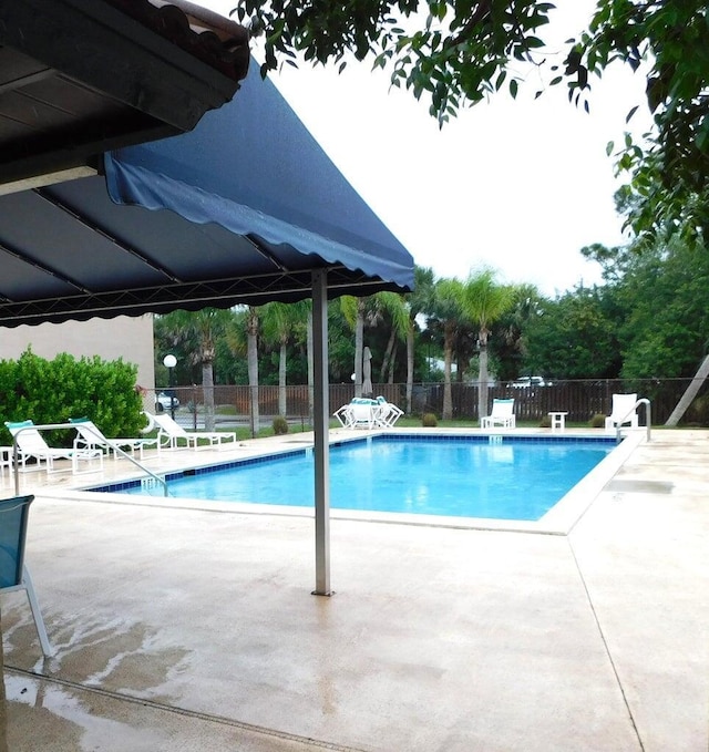 view of pool featuring a patio area