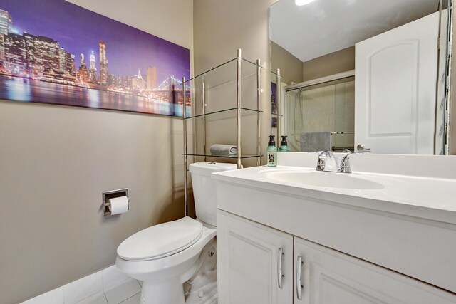 bathroom with hardwood / wood-style floors, vanity, and toilet