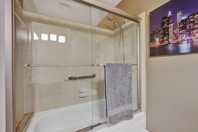 bathroom with tile patterned flooring, vanity, toilet, and a shower with shower door