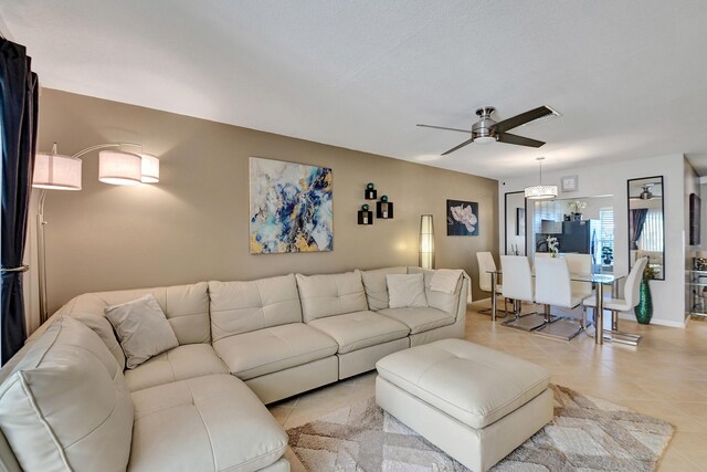 dining room featuring ceiling fan and light tile patterned floors