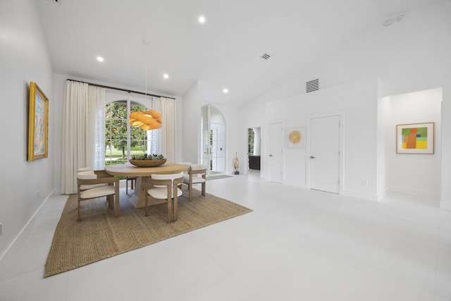 dining room featuring lofted ceiling