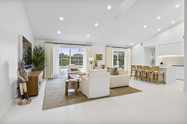 tiled living room featuring lofted ceiling