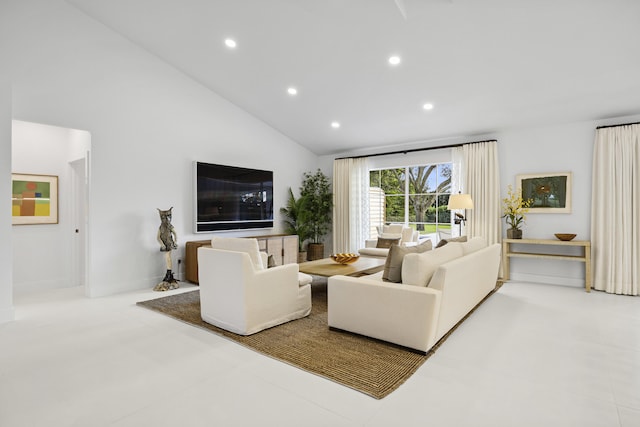 living room featuring high vaulted ceiling