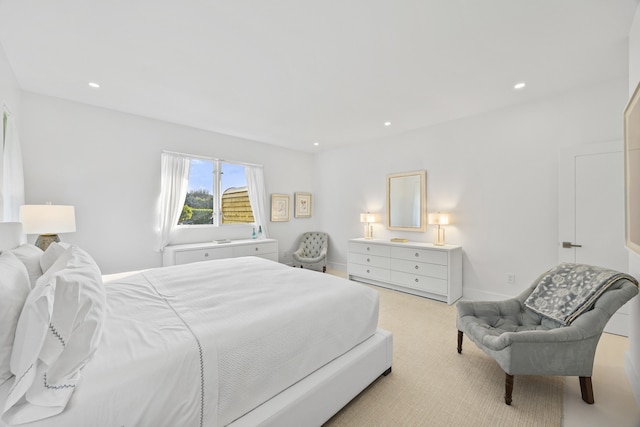 bedroom featuring light carpet