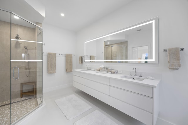 bathroom featuring an enclosed shower and vanity