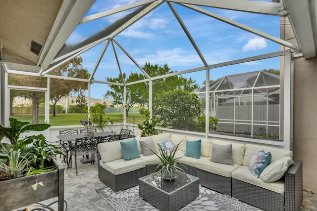 view of patio with an outdoor living space and glass enclosure