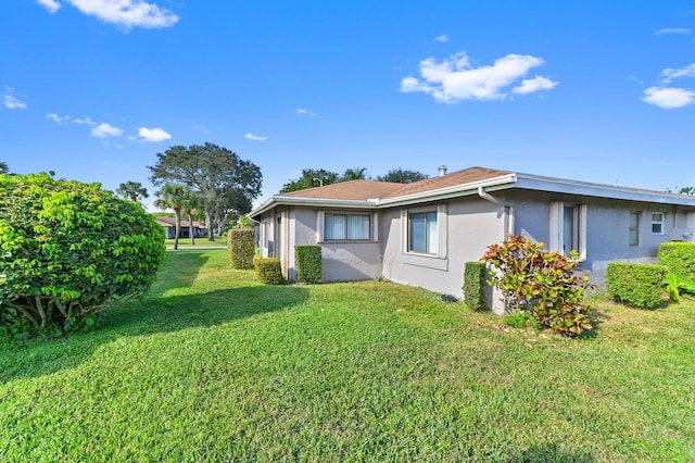 view of property exterior featuring a yard