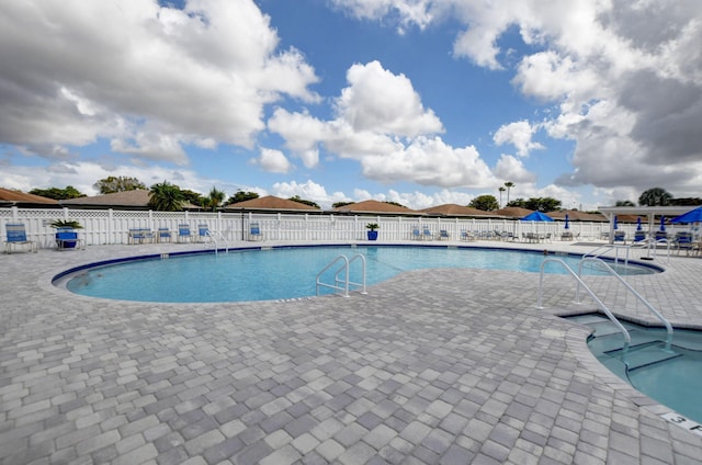 view of pool featuring a patio area