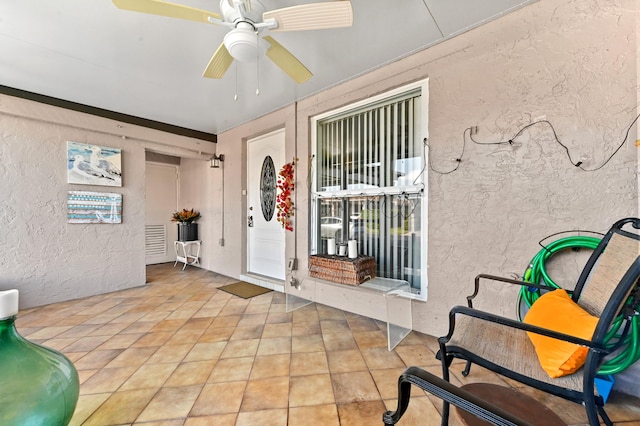 interior space featuring ceiling fan and a patio area