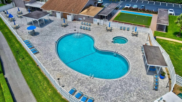 view of pool with a patio area and a community hot tub