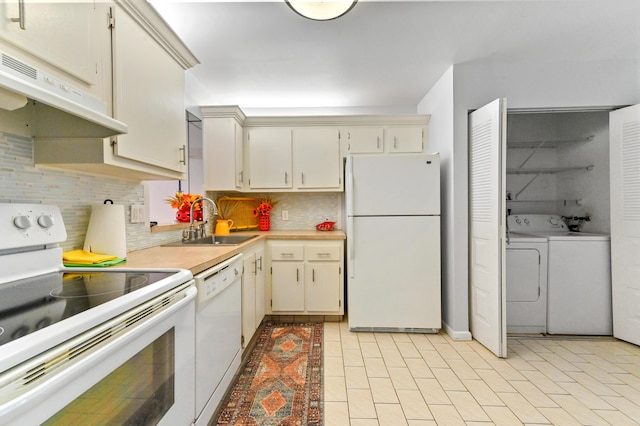 kitchen with sink, white appliances, backsplash, and cream cabinets