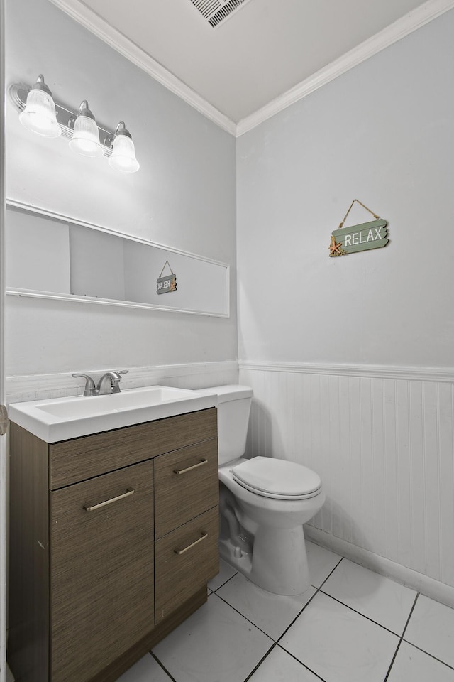 bathroom featuring ornamental molding, vanity, toilet, and tile patterned flooring