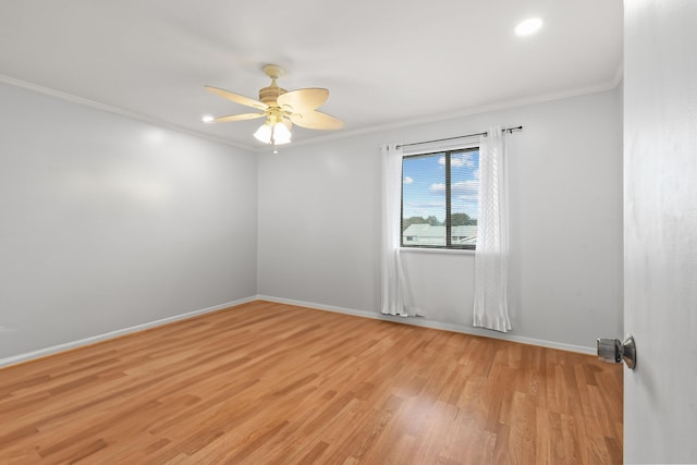 empty room featuring crown molding, ceiling fan, and light hardwood / wood-style flooring