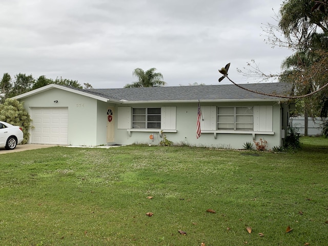 single story home featuring a garage and a front lawn