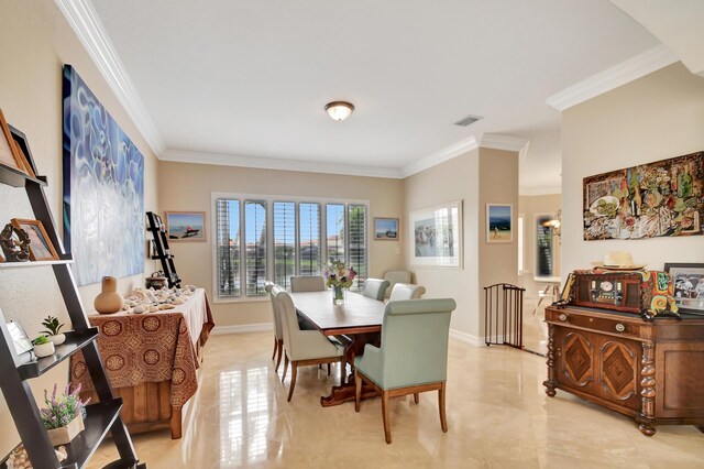 kitchen with white cabinets, light tile patterned flooring, crown molding, and tasteful backsplash