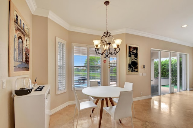 dining space featuring crown molding and a notable chandelier