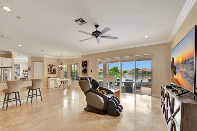 living room with ceiling fan with notable chandelier and ornamental molding