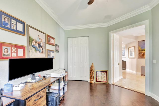 office space with ceiling fan, dark hardwood / wood-style floors, and ornamental molding