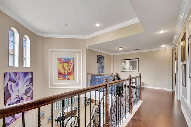 corridor with dark hardwood / wood-style flooring and ornamental molding