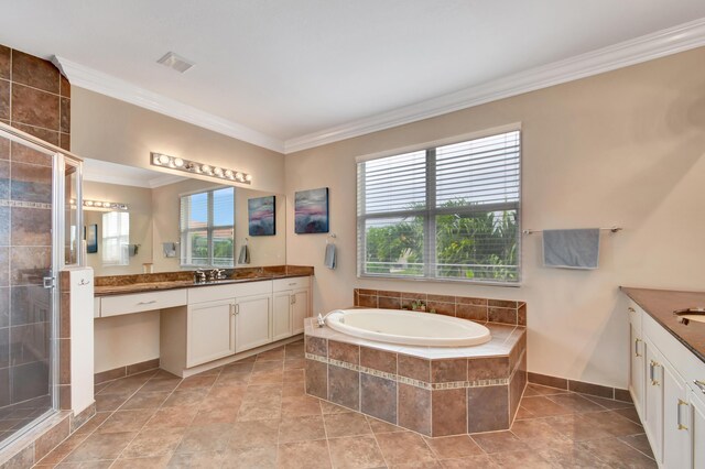 bathroom with vanity, crown molding, and independent shower and bath