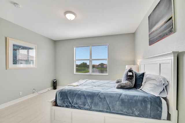 bedroom with light hardwood / wood-style flooring