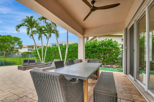 view of patio featuring ceiling fan