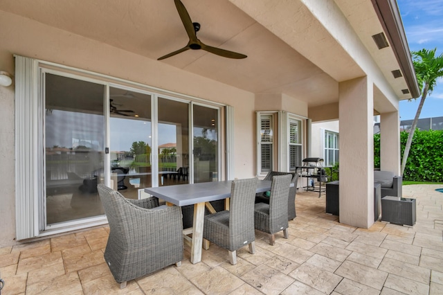 view of patio featuring ceiling fan