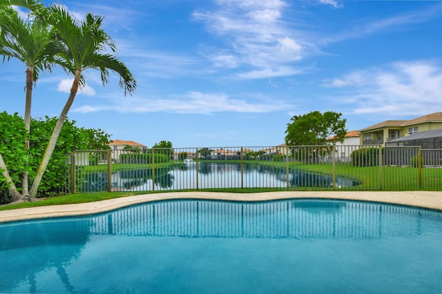 view of pool with a water view