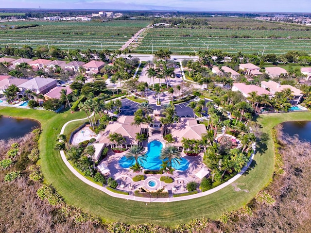 drone / aerial view featuring a water view and a rural view