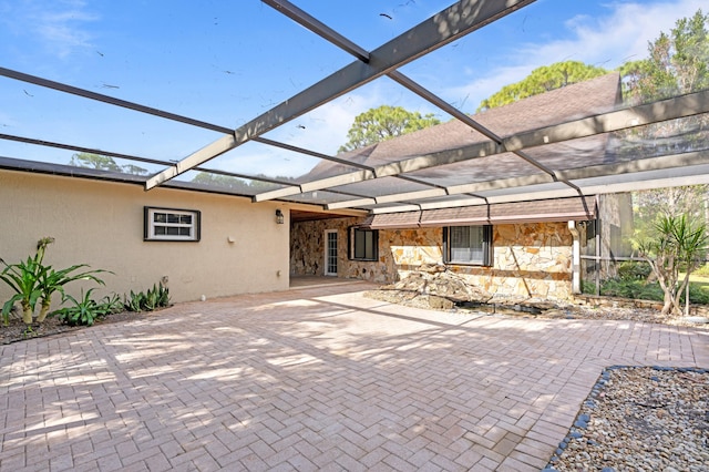 view of patio / terrace with a lanai