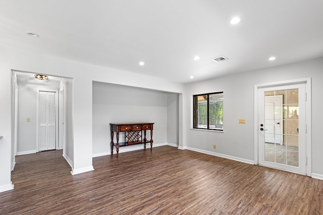 unfurnished room with dark hardwood / wood-style floors