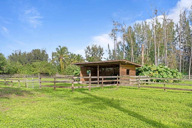 view of stable featuring a rural view