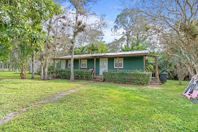 ranch-style home featuring a front yard