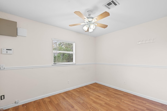 unfurnished room with ceiling fan and light wood-type flooring