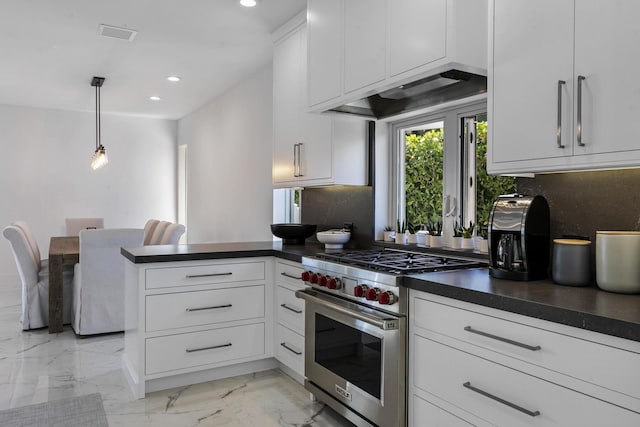 kitchen with premium range, pendant lighting, white cabinets, backsplash, and kitchen peninsula