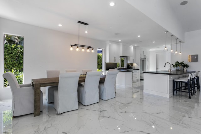 dining space featuring sink