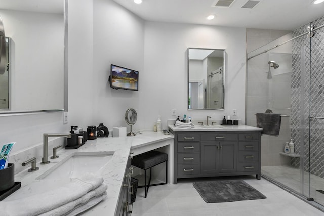 bathroom with vanity and an enclosed shower