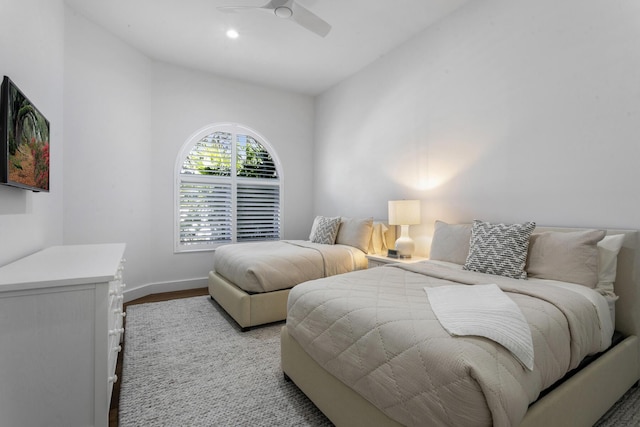 bedroom with light hardwood / wood-style flooring and ceiling fan