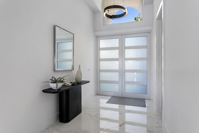 foyer entrance with a towering ceiling