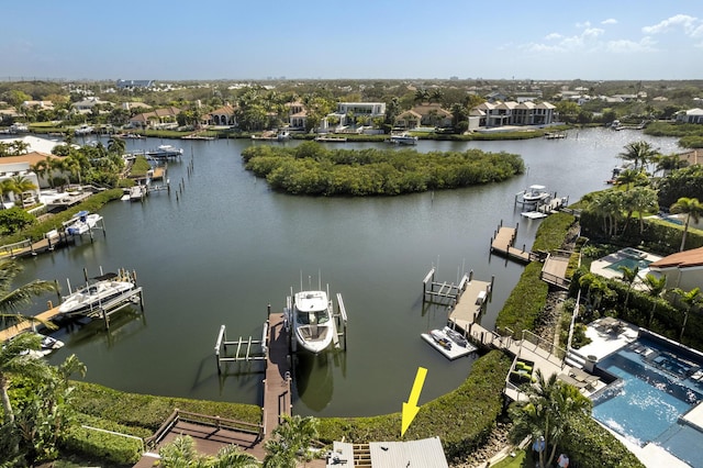 birds eye view of property with a water view